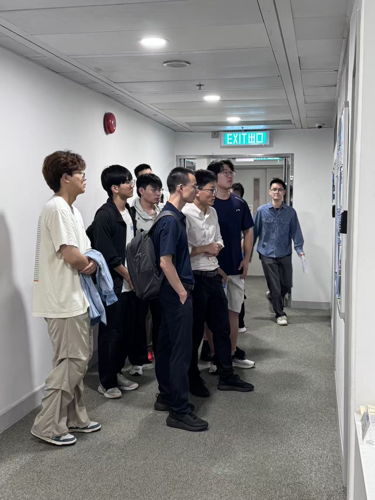 Shandong University students viewing AAE research displays at PolyU