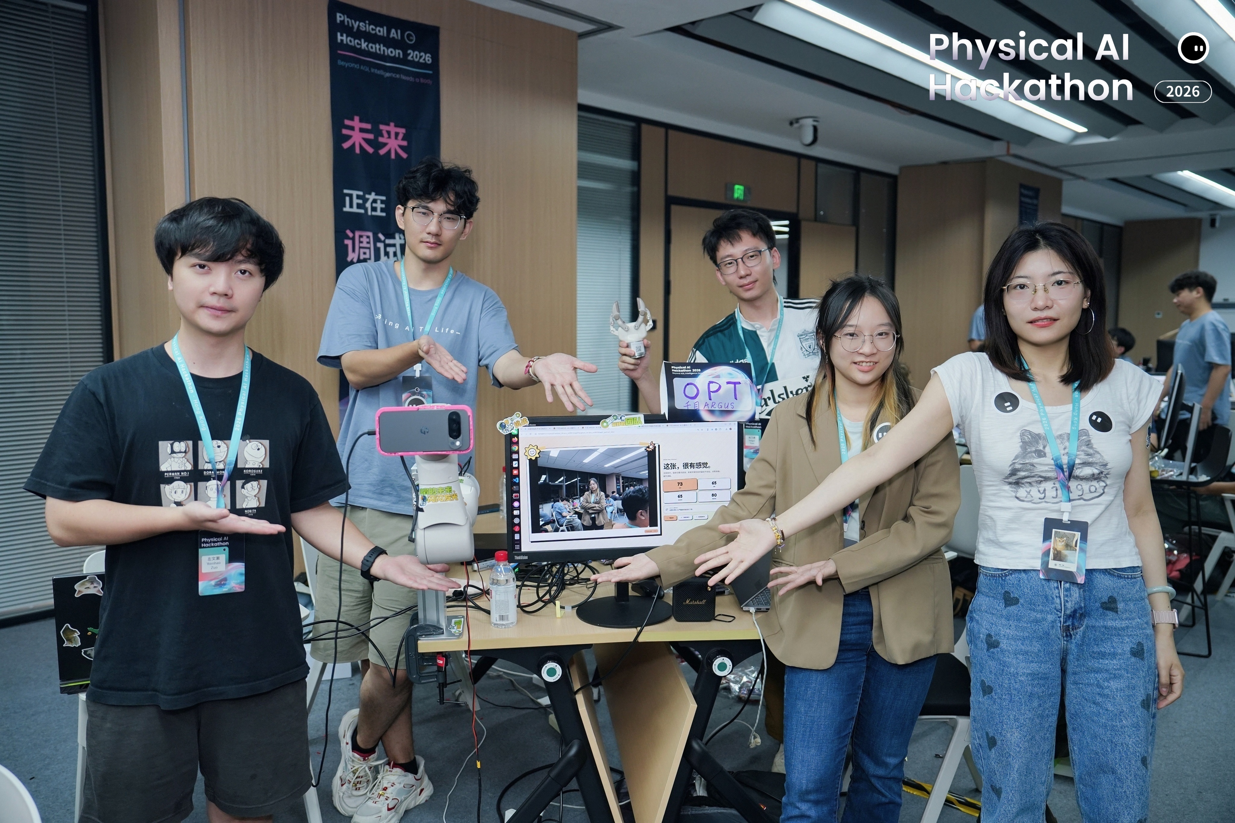 The ARGUS team demonstrating its robotic portrait photography system