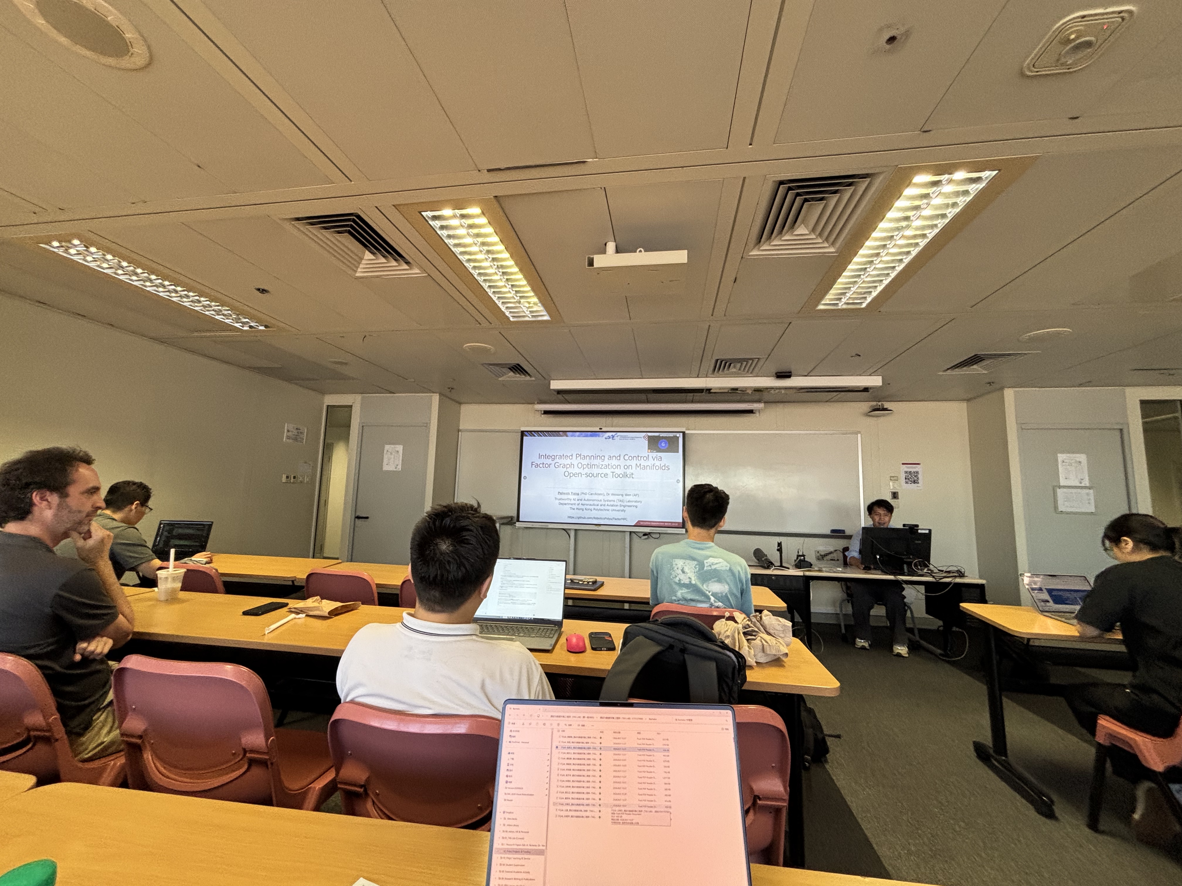 A research presentation on an open-source toolkit for integrated planning and control via factor graph optimization on manifolds.