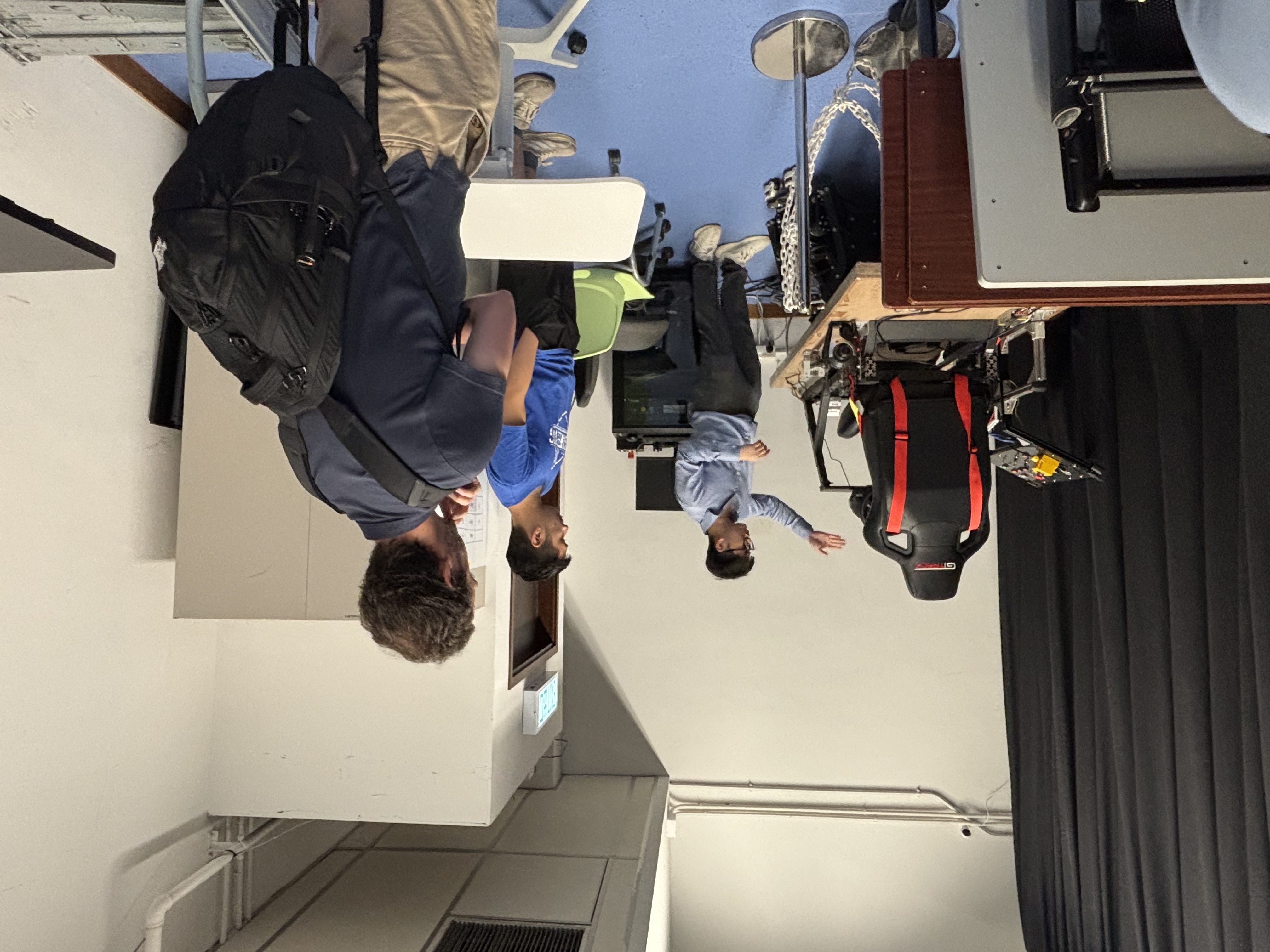An introduction to a seated simulator platform during the visit to Prof. Chen SUN s laboratory at HKU.