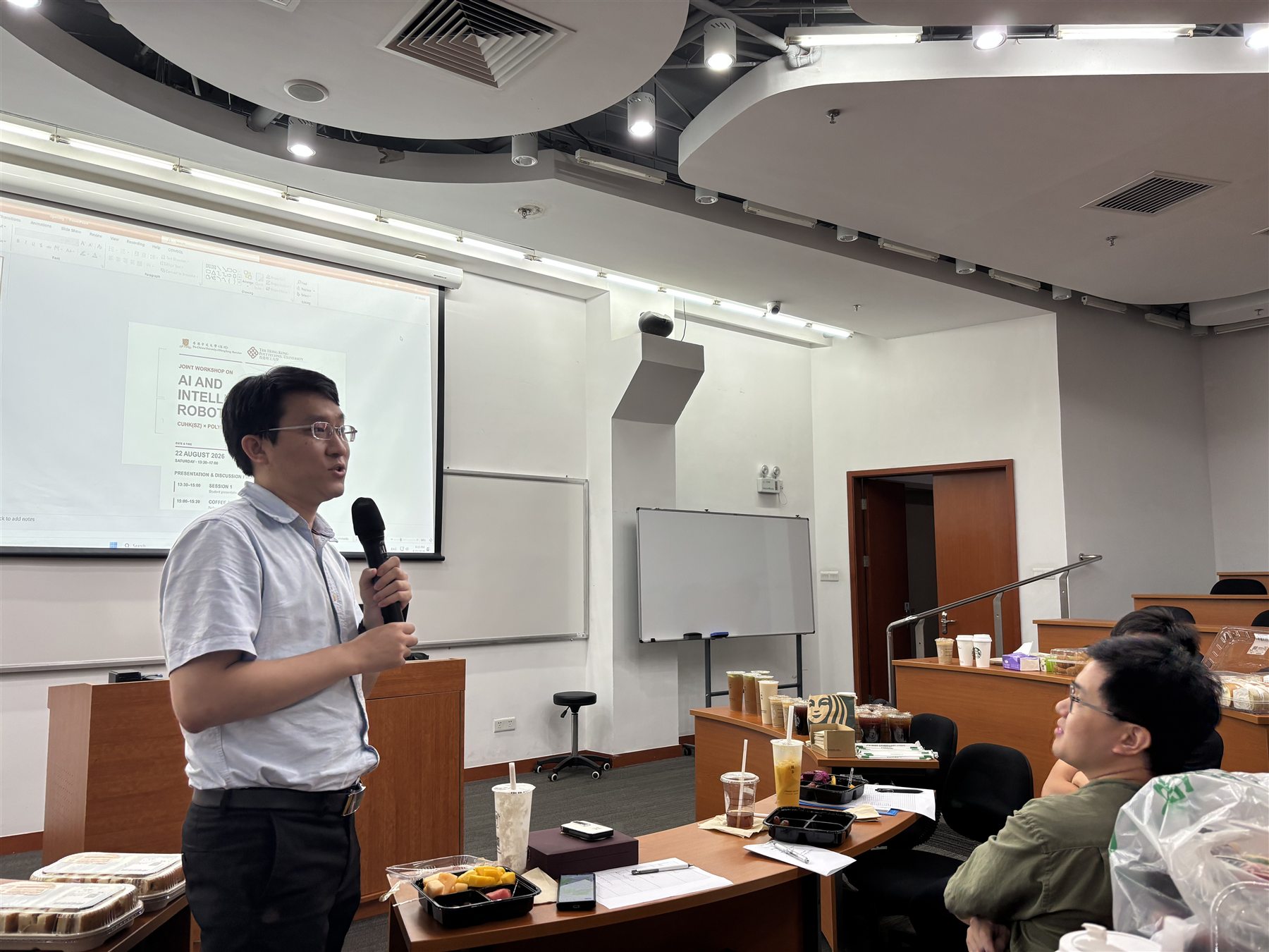Professor Weisong Wen delivers closing remarks to workshop participants