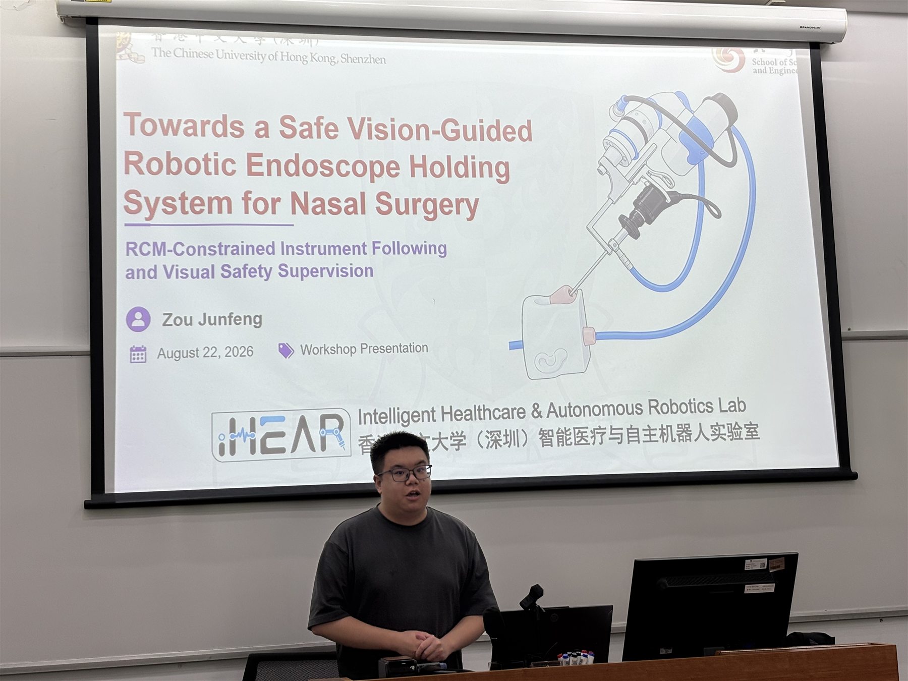 Junfeng Zou presents a vision-guided robotic endoscope holding system