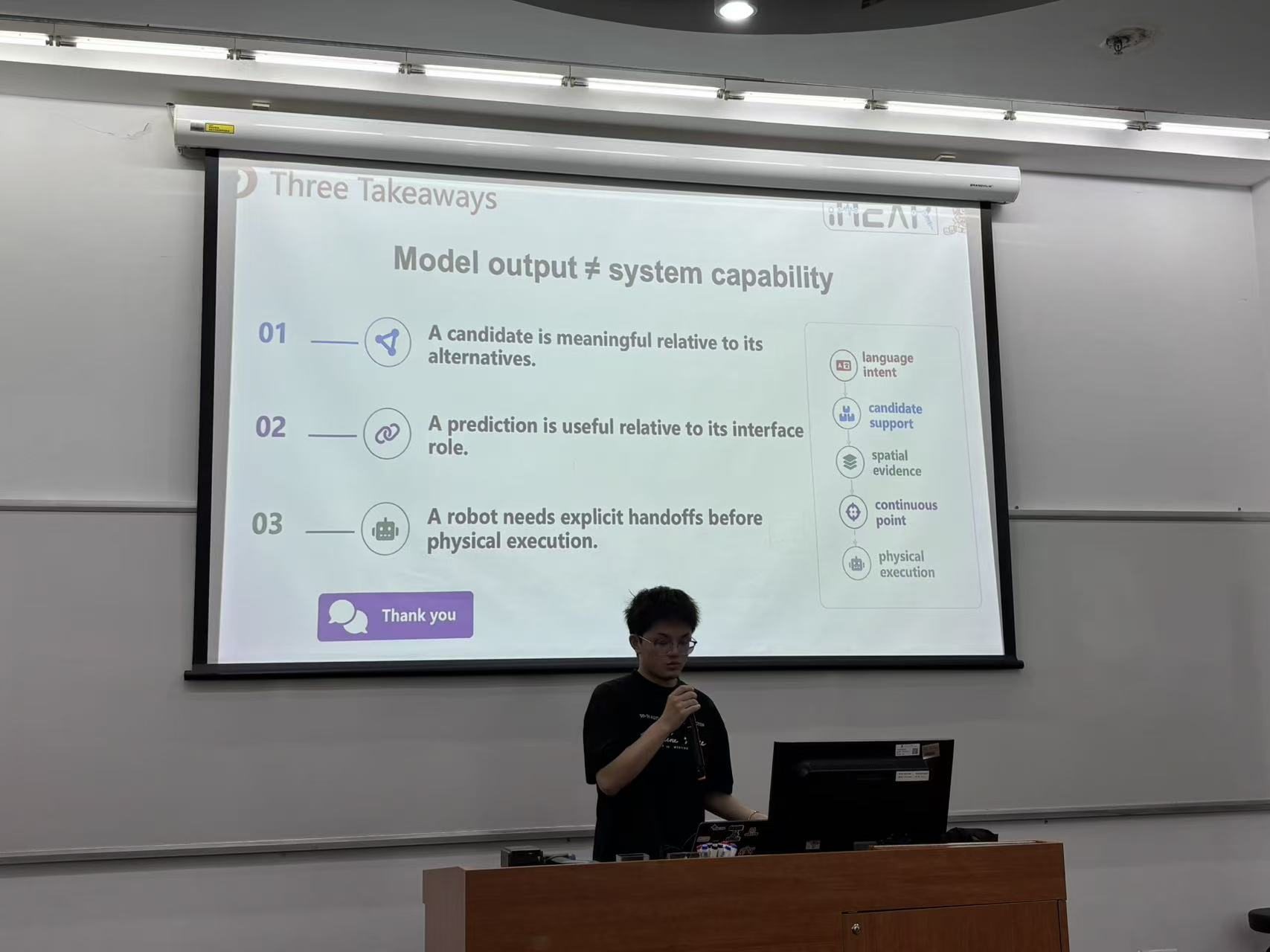 A speaker discusses usable and diagnosable language-guided robot perception