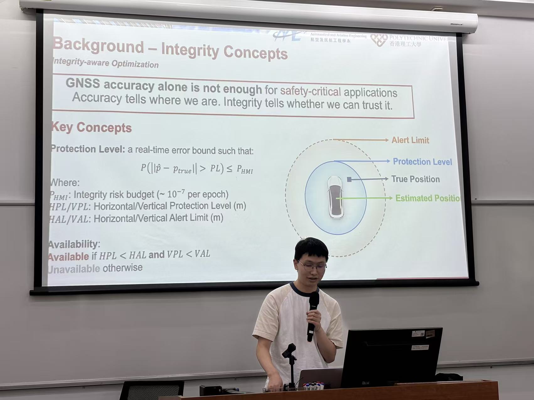 A workshop speaker explains integrity-aware positioning concepts