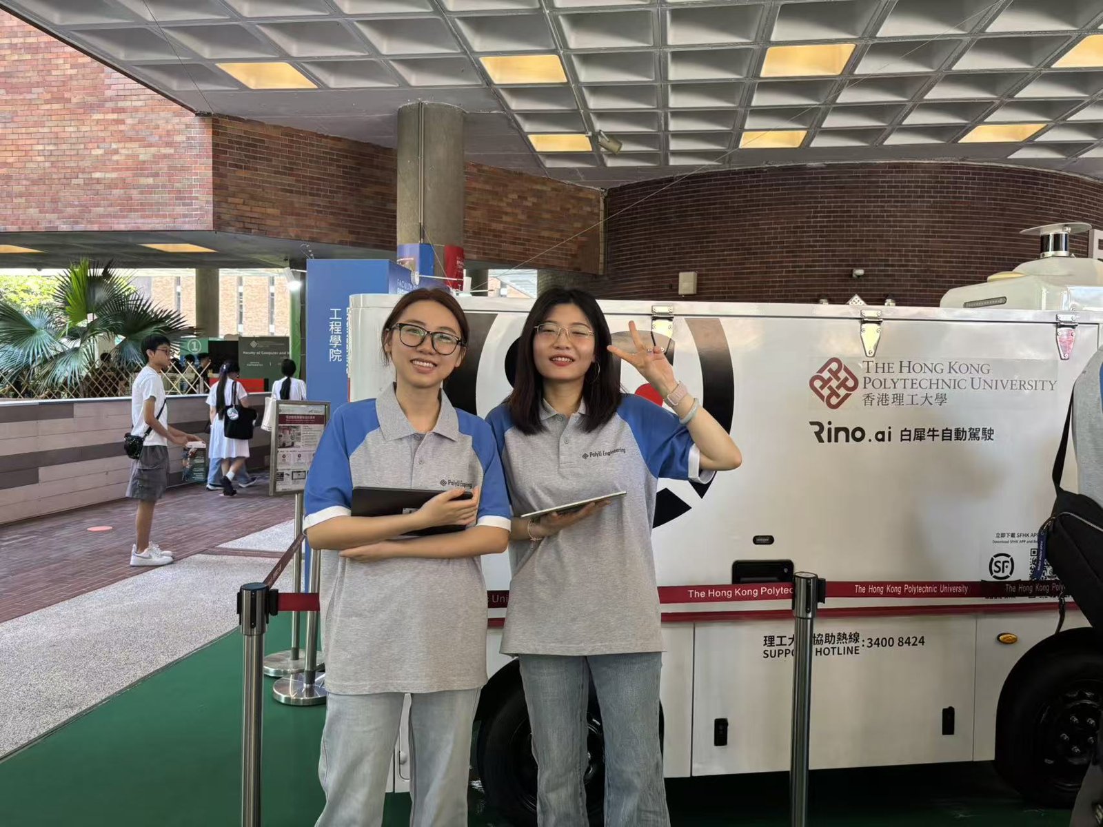 TASLAB members in front of the autonomous delivery vehicle