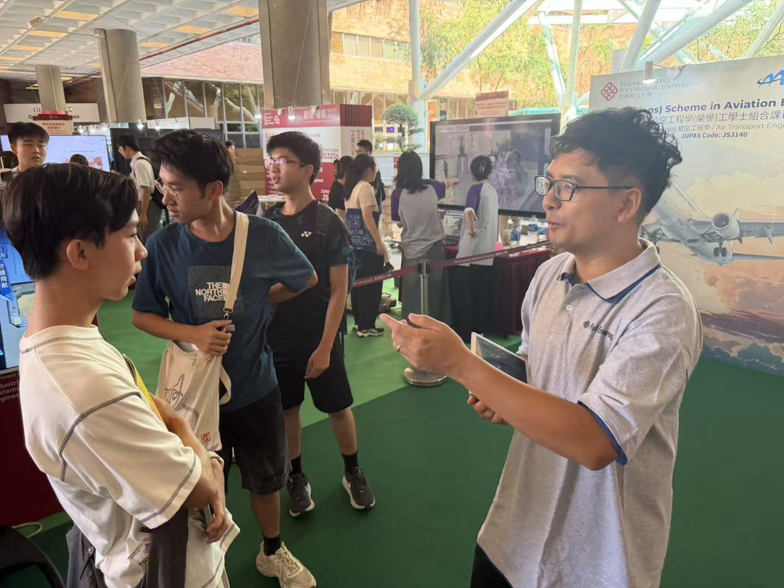 TASLAB member talking with prospective students